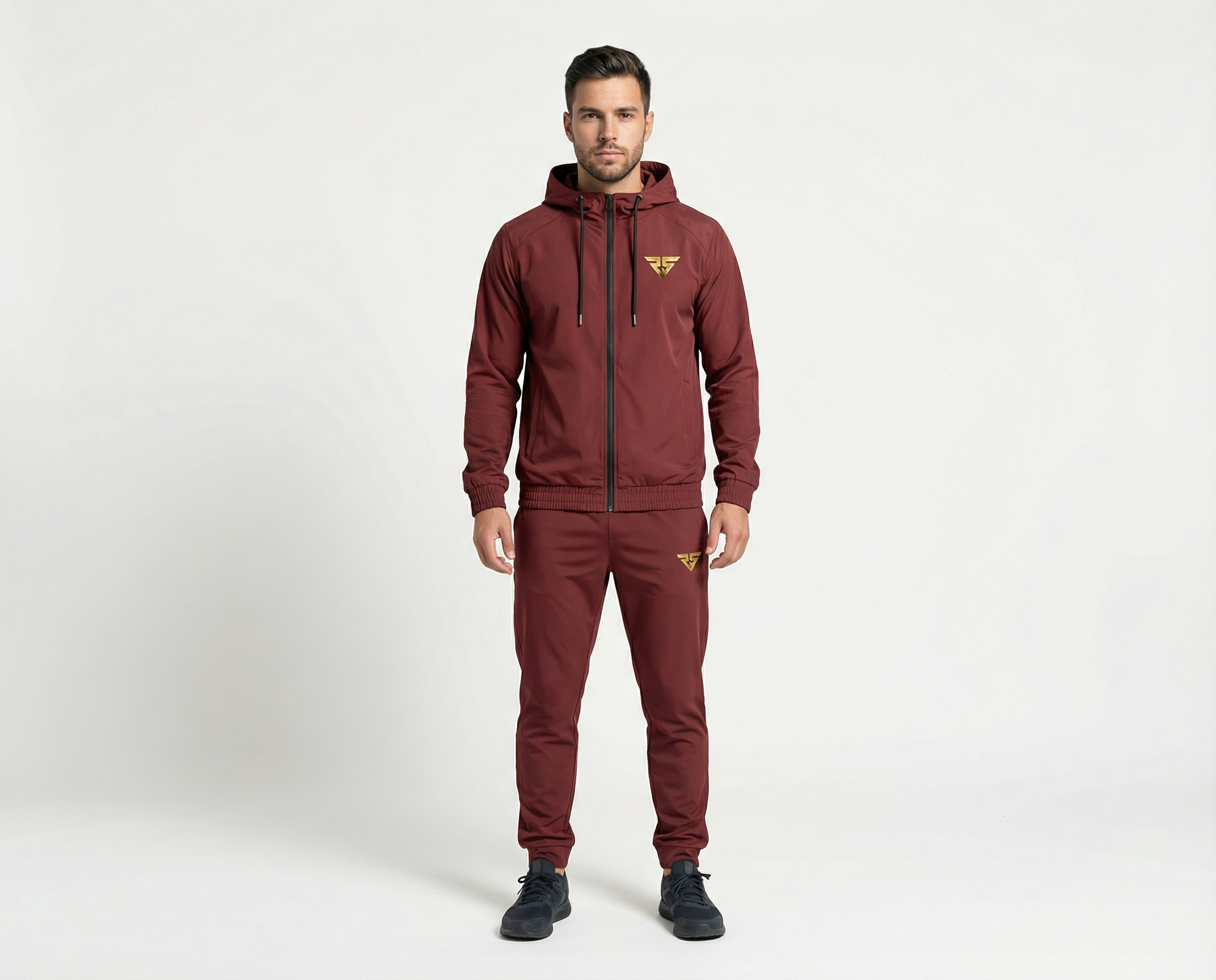 Full front view of men's maroon full-zip hooded tracksuit with matching tapered pants and gold logos