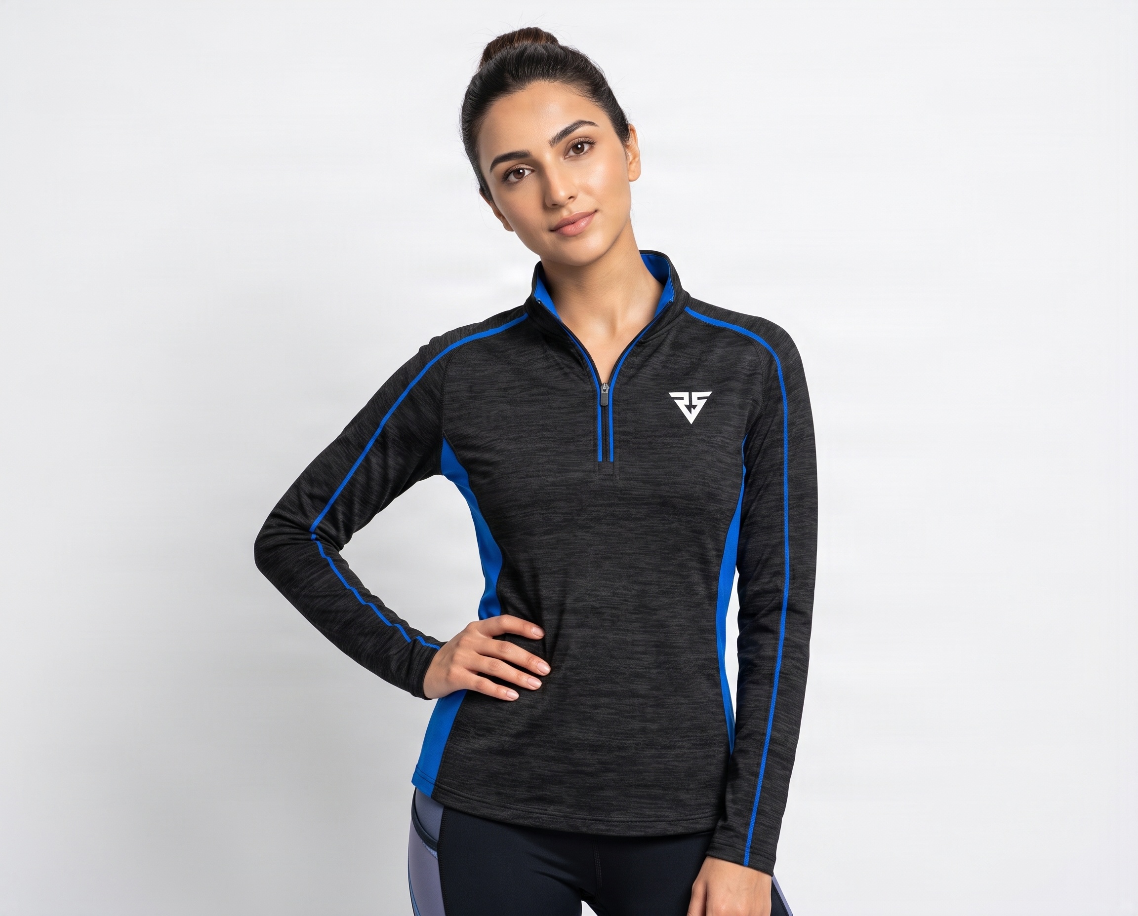 Front detail of women’s performance midlayer with quarter zip, melange fabric and blue contrast panels