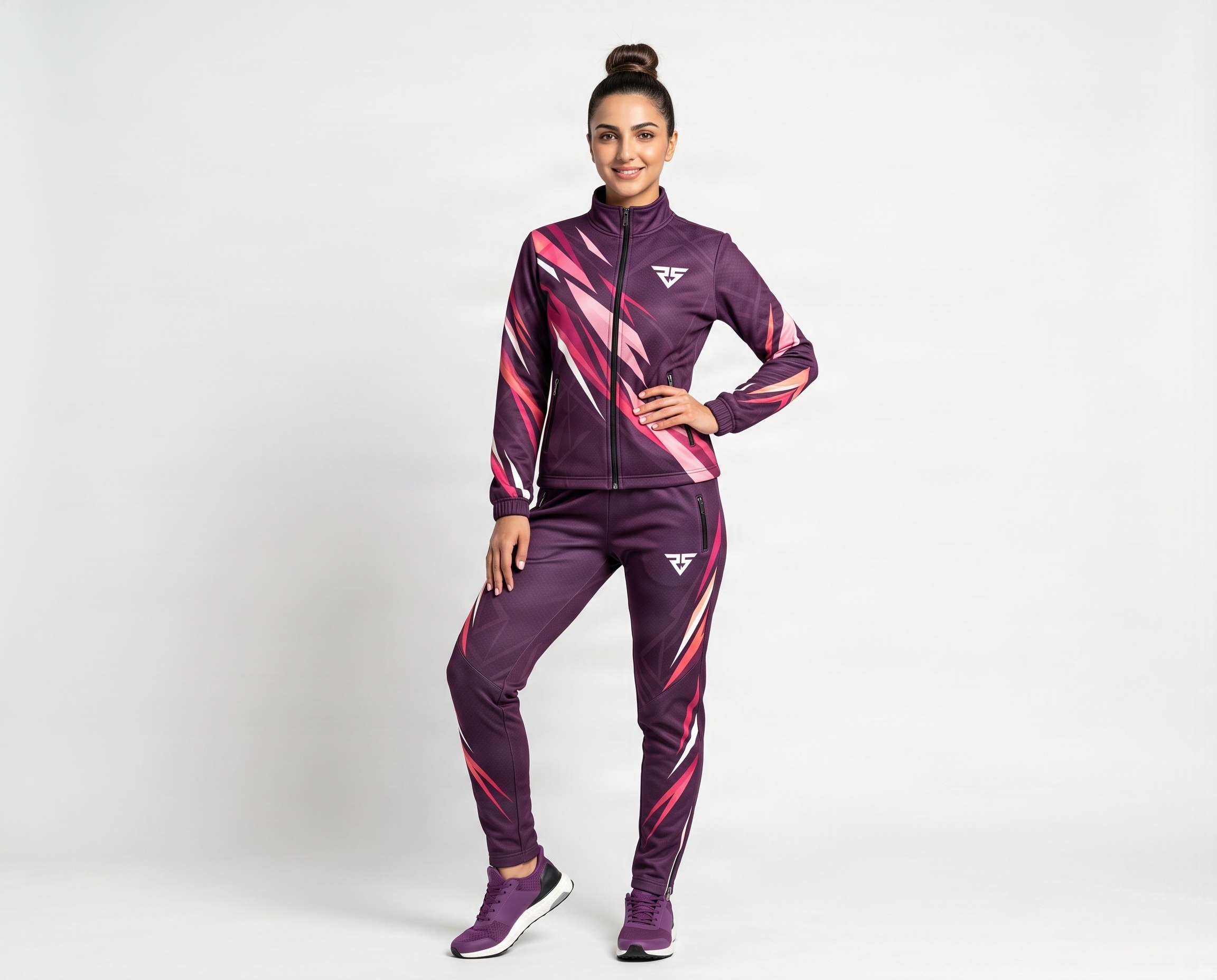 Front view of custom women’s sublimated team tracksuit with full-zip jacket and tapered pants