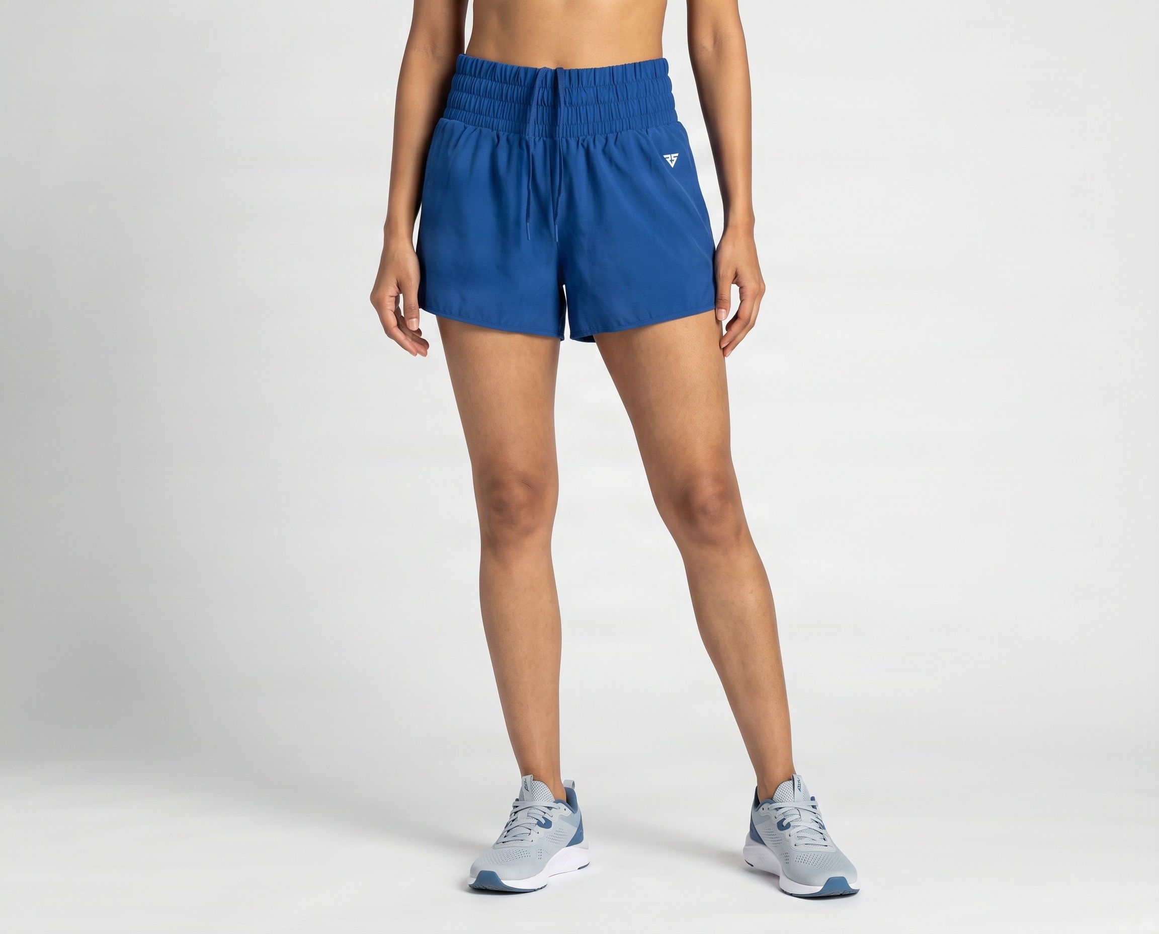 Blue women’s training shorts with wide elastic waistband and adjustable drawcord by Remington