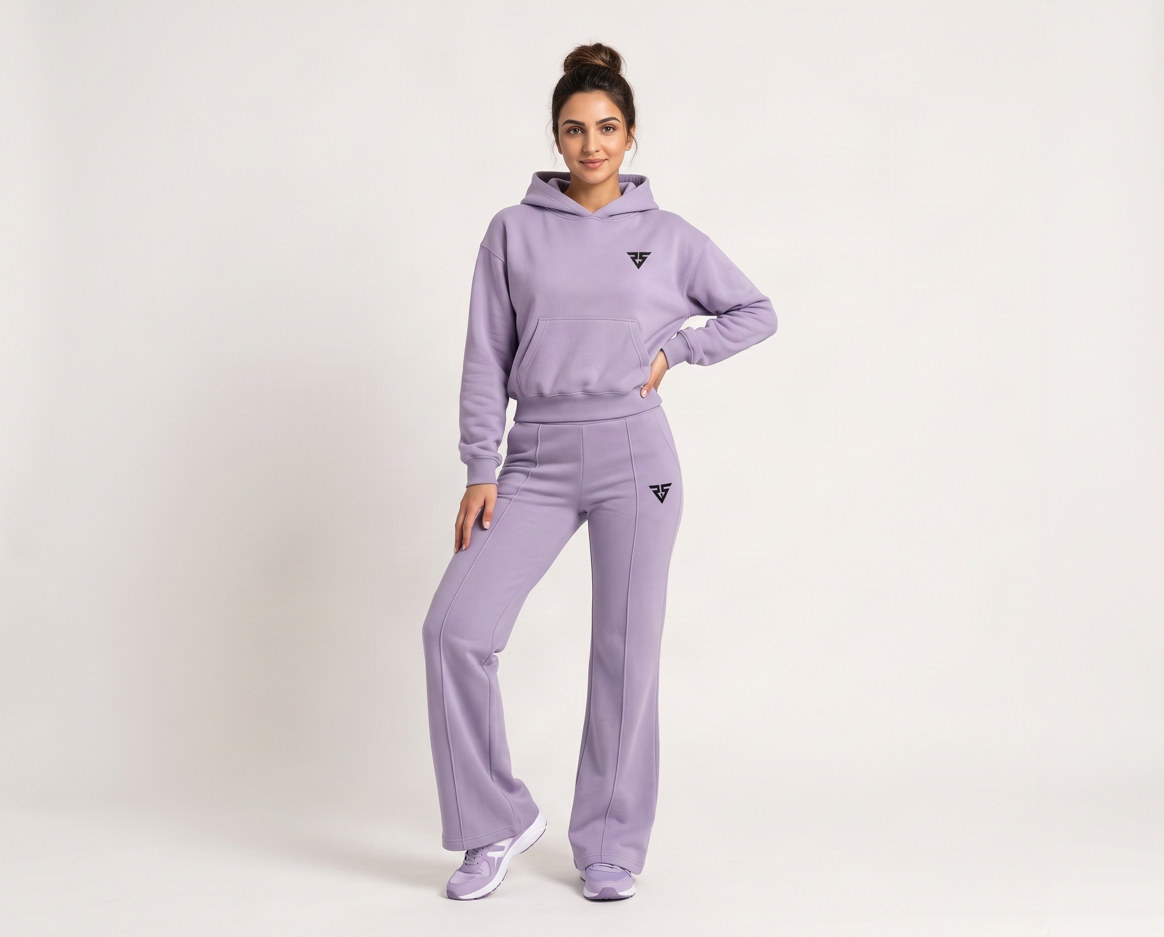 Front view of women's lilac hoodie and wide-leg pants lounge set with black geometric logos and front seam detailing