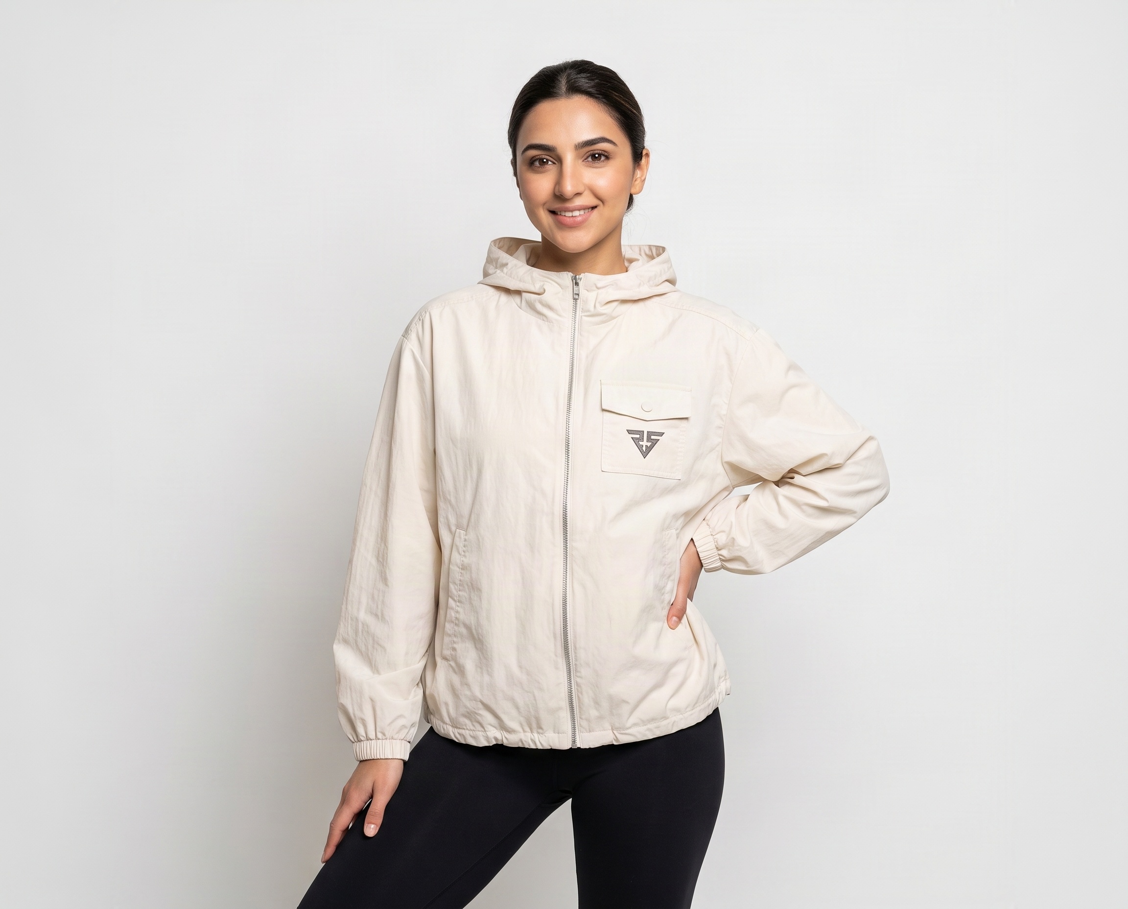 Front view of women's ivory-cream full-zip hooded jacket with flap chest pocket and geometric logo